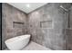 Elegant bathroom featuring a sleek standalone tub and stylish gray marble shower at 32 Walthall Ne St # A, Atlanta, GA 30307