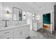 Bright bathroom featuring dual vanities, modern fixtures, and a glass-enclosed shower at 32 Walthall Ne St # A, Atlanta, GA 30307