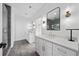 Bright bathroom featuring dual vanities, modern fixtures, and a glass-enclosed shower at 32 Walthall Ne St # A, Atlanta, GA 30307