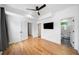 Spacious bedroom with hardwood floors, modern ceiling fan, and ensuite bathroom access at 32 Walthall Ne St # A, Atlanta, GA 30307