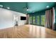 Large primary bedroom with balcony doors, ceiling fan and access to a bathroom at 32 Walthall Ne St # A, Atlanta, GA 30307
