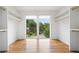 Bright walk-in closet with custom shelving and a large window with neighborhood views at 32 Walthall Ne St # A, Atlanta, GA 30307
