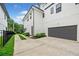 Modern home exterior with a gray door garage and a landscaped driveway at 32 Walthall Ne St # A, Atlanta, GA 30307