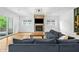 Modern living room with fireplace, TV, and glass patio doors at 32 Walthall Ne St # A, Atlanta, GA 30307