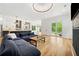 Open concept living room and kitchen with hardwood floors and modern finishes at 32 Walthall Ne St # A, Atlanta, GA 30307