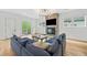 Comfortable living room with fireplace, TV, and a large sectional sofa at 32 Walthall Ne St # A, Atlanta, GA 30307