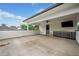 Spacious outdoor patio with covered ceiling fan, built-in stainless grill, and TV at 32 Walthall Ne St # A, Atlanta, GA 30307