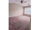 Bright bedroom with a ceiling fan and large window providing natural light at 3645 Mcclaren Way, Lawrenceville, GA 30044