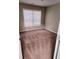 Comfortable bedroom with plush carpet, neutral walls, and a bright window at 3645 Mcclaren Way, Lawrenceville, GA 30044