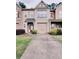 Charming townhome featuring a one car garage and well-maintained landscaping at 3645 Mcclaren Way, Lawrenceville, GA 30044