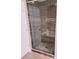 Modern walk-in shower with stone tile floor and built-in shower niche at 3645 Mcclaren Way, Lawrenceville, GA 30044
