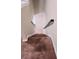 Carpeted staircase with a sleek black handrail and white trim, leading downstairs at 3645 Mcclaren Way, Lawrenceville, GA 30044