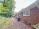 Exterior view of home's brick facade with landscaping and driveway at 4103 Indian Creek Cir, Stone Mountain, GA 30083