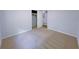 Spacious bedroom with neutral walls, plush carpet, closet, and access to an adjoining room at 4103 Indian Creek Cir, Stone Mountain, GA 30083