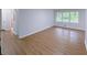A bedroom featuring new laminate floors and natural light at 4103 Indian Creek Cir, Stone Mountain, GA 30083