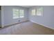 Cozy bedroom with two windows, fresh paint, plush carpeting, and a closet at 4103 Indian Creek Cir, Stone Mountain, GA 30083