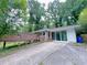 Charming brick home with a spacious driveway and inviting outdoor deck at 4103 Indian Creek Cir, Stone Mountain, GA 30083