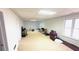 This unfinished basement is filled with possibilities, with neutral walls, carpeted floor, and two windows at 4569 Campenille Trce, Suwanee, GA 30024