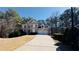 Traditional two-story home with manicured lawn, driveway, and an attached two-car garage at 4569 Campenille Trce, Suwanee, GA 30024