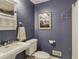 Full bathroom with a pedestal sink, towel rack, and framed print at 2177 Mauldin Nw St, Atlanta, GA 30318