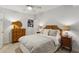 Calm bedroom with neutral carpet, a ceiling fan and two nightstands at 2177 Mauldin Nw St, Atlanta, GA 30318