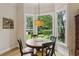 Charming breakfast nook with a round table, surrounded by large windows offering scenic views of the outdoors at 2177 Mauldin Nw St, Atlanta, GA 30318