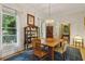 Traditional dining room with hardwood floors, large window, display cabinet and an ornate light fixture at 2177 Mauldin Nw St, Atlanta, GA 30318