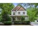 Beautiful two-story home featuring cedar shake accents, light-colored siding, and a covered front porch at 2177 Mauldin Nw St, Atlanta, GA 30318
