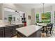 Stylish kitchen with an island, stainless steel appliances, open layout, and views of an adjacent breakfast nook at 2177 Mauldin Nw St, Atlanta, GA 30318