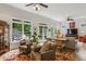 Bright living room with large windows, hardwood floors, neutral decor, and access to an outdoor deck at 2177 Mauldin Nw St, Atlanta, GA 30318