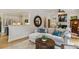 Cozy living room featuring neutral tones, hardwood floors, a fireplace, and an eat-in kitchen nearby at 2177 Mauldin Nw St, Atlanta, GA 30318
