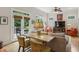Inviting living room featuring a doorway to a deck, neutral colors, ceiling fan, and a comfortable sofa at 2177 Mauldin Nw St, Atlanta, GA 30318