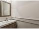 Well-lit powder room with a modern sink and vanity, complementing the neutral color scheme at 2177 Mauldin Nw St, Atlanta, GA 30318