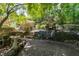 Beautiful brick-laid patio surrounded by manicured landscaping with serene backyard setting at 3511 Stone Cliff Way, Woodstock, GA 30189