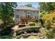 Beautiful backyard featuring a deck, patio and lush greenery at 3511 Stone Cliff Way, Woodstock, GA 30189