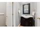 Bathroom featuring a dark vanity and matching framed mirror at 3511 Stone Cliff Way, Woodstock, GA 30189