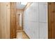 Spacious closet with built-in storage, shelving, and unique wood paneled accents at 3511 Stone Cliff Way, Woodstock, GA 30189