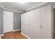 Spacious closet featuring white storage units and wood floors at 3511 Stone Cliff Way, Woodstock, GA 30189