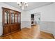 Dining room with hardwood floors, a china cabinet, and view of the living room at 3511 Stone Cliff Way, Woodstock, GA 30189