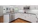 Well-lit kitchen with white cabinets, stainless steel appliances, and a modern design at 3511 Stone Cliff Way, Woodstock, GA 30189
