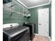 Practical laundry room area featuring modern machines and shelving at 3511 Stone Cliff Way, Woodstock, GA 30189