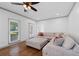 Bright living room features a large window with natural light and a comfortable sectional sofa at 3511 Stone Cliff Way, Woodstock, GA 30189
