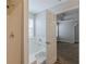 Bright bathroom featuring a soaking tub next to the bedroom, with a shower behind clear doors at 4185 Post Oak Grv, Atlanta, GA 30349
