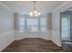 Bright dining area featuring wood floors, crown molding, and natural light at 4185 Post Oak Grv, Atlanta, GA 30349