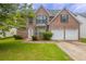 Charming two-story brick home with a well-manicured lawn and two-car garage, perfect for a Gathering at 4185 Post Oak Grv, Atlanta, GA 30349