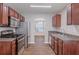 Well-equipped kitchen featuring stainless steel appliances, and dark cabinets, a chef's delight at 4185 Post Oak Grv, Atlanta, GA 30349
