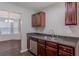 Kitchen area with stainless steel appliances, ample cabinet space, and view into bright dining area at 4185 Post Oak Grv, Atlanta, GA 30349