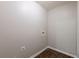 The laundry room includes hookups and nice wood look flooring at 4185 Post Oak Grv, Atlanta, GA 30349