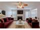 Inviting living room with fireplace, plush seating, and modern decor, ideal for relaxation and entertaining at 4185 Post Oak Grv, Atlanta, GA 30349