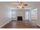 Spacious living room with wood floors, a fireplace, and a ceiling fan at 4185 Post Oak Grv, Atlanta, GA 30349
